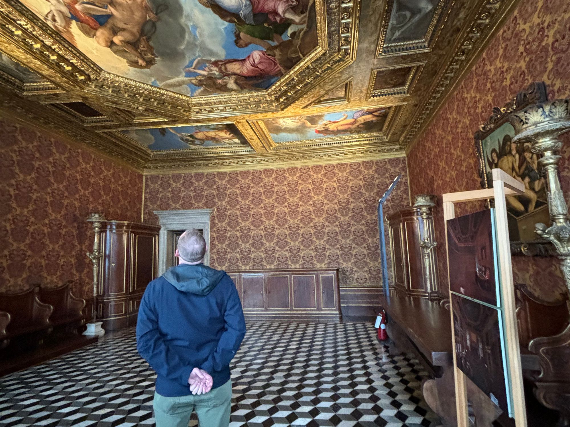 A photo of me, admiring the ceiling in an opulent room within the Doge’s palace