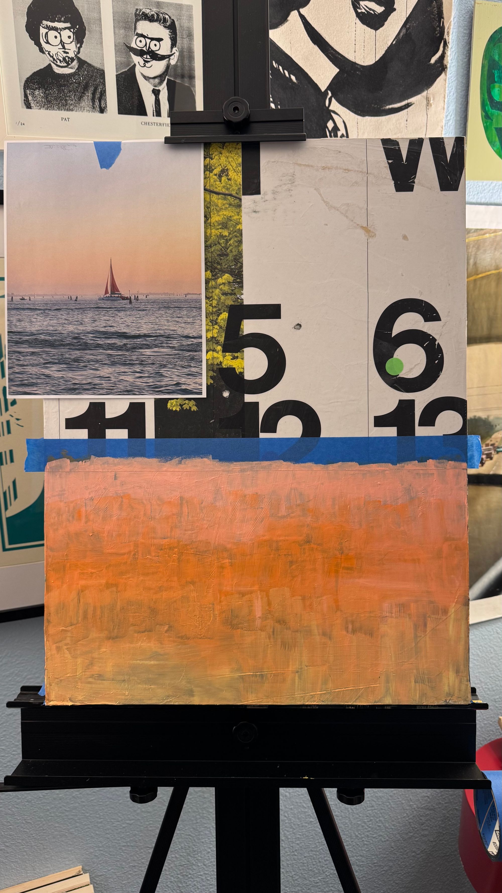 Photo of a painting in progress showing a color gradient painted where the ocean will go.