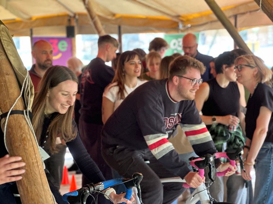 Charity team building: a team with the bikes they built, ready for the charity to collect