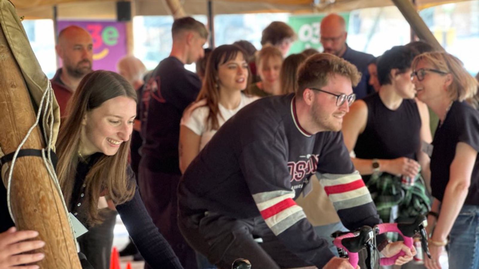 Charity team building: a team with the bikes they built, ready for the charity to collect