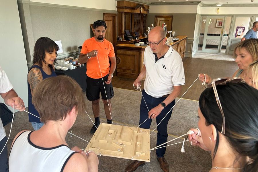 A team working out a build problem together around a table