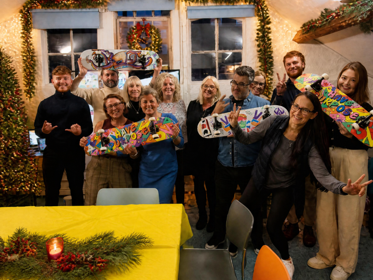 Team celebrating thei Festive Skateboard Team Build event