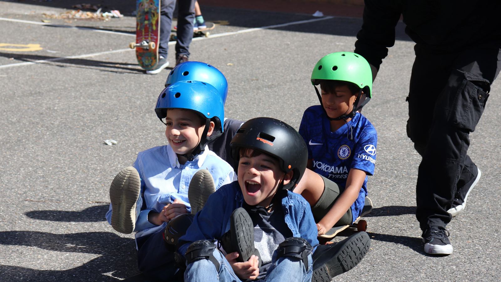 Children enjoy playing with skateboards donated from our OnBoard event.