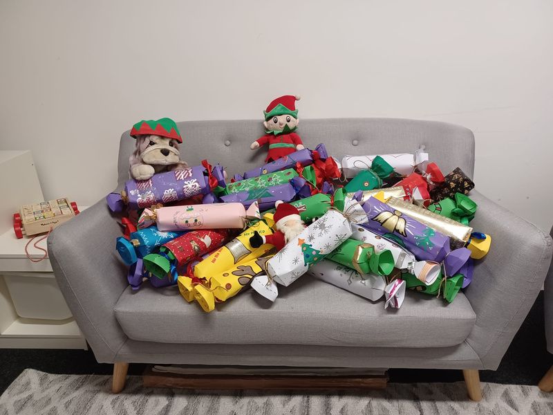 A collection of oversized hand made christmas crackers ready for donation 