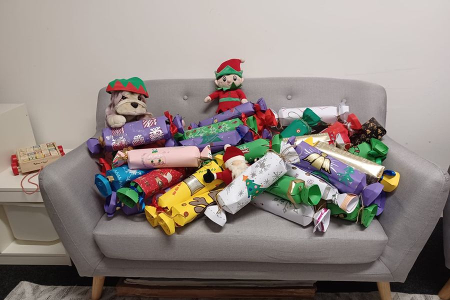 A collection of oversized hand made christmas crackers ready for donation