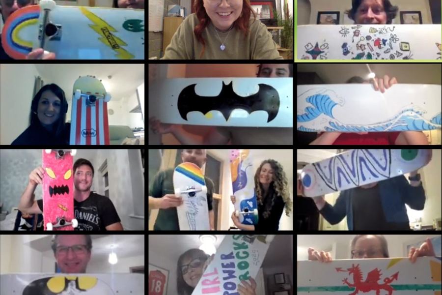 A video call grid of people holding up what they made