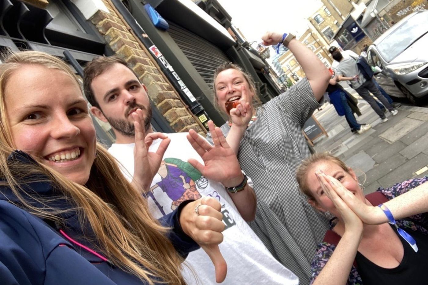 A team celebrating during a multi activity charity challenge