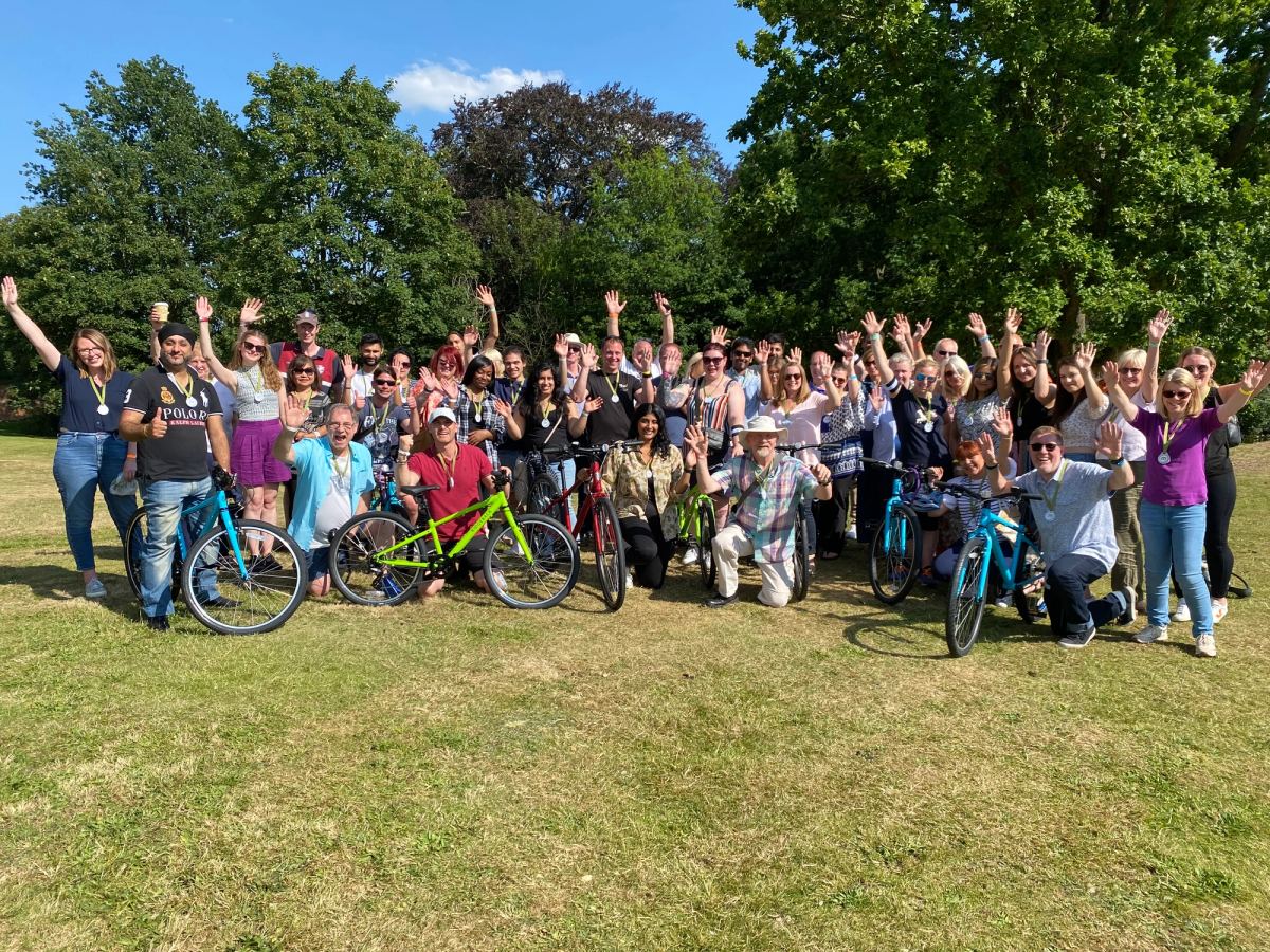 Celebration of a completed Charity Bike Build held outside at Stoke Poges