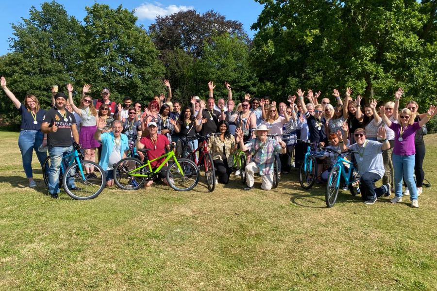 Celebration of a completed Charity Bike Build held outside at Stoke Poges