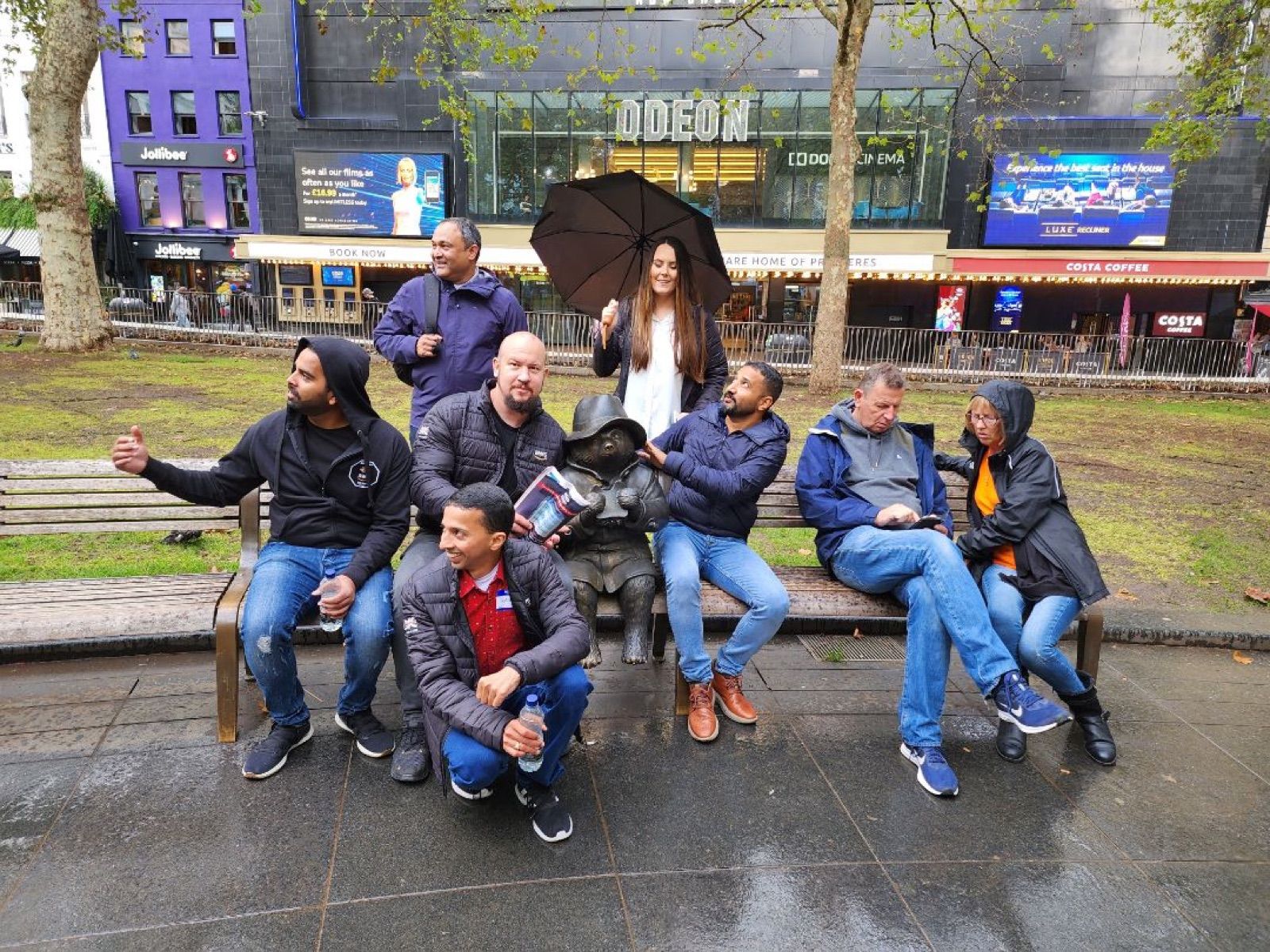 A Benevohunt team posing with the Paddington statue in Leicester Square
