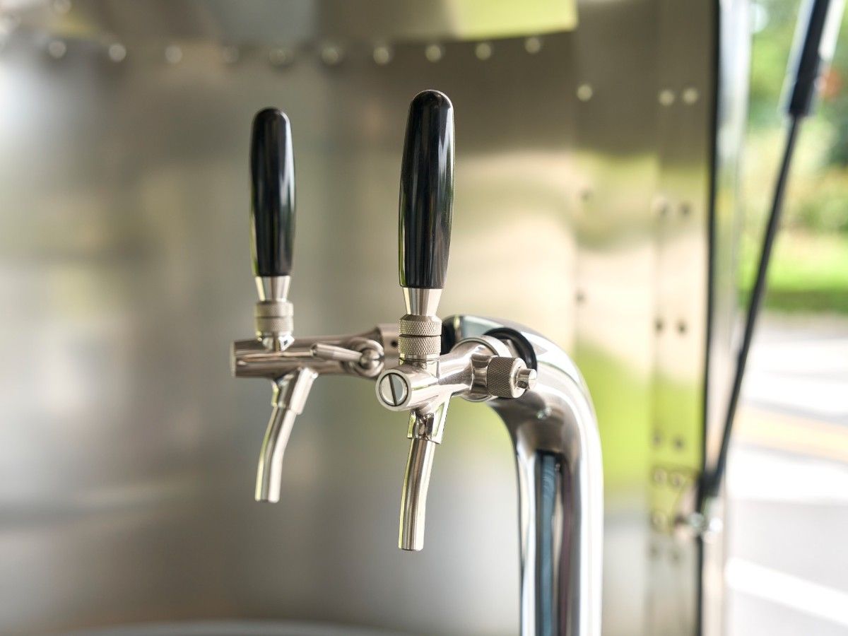 Dual tap draft beer tower installed on a Chris Machinery mobile catering trailer counter