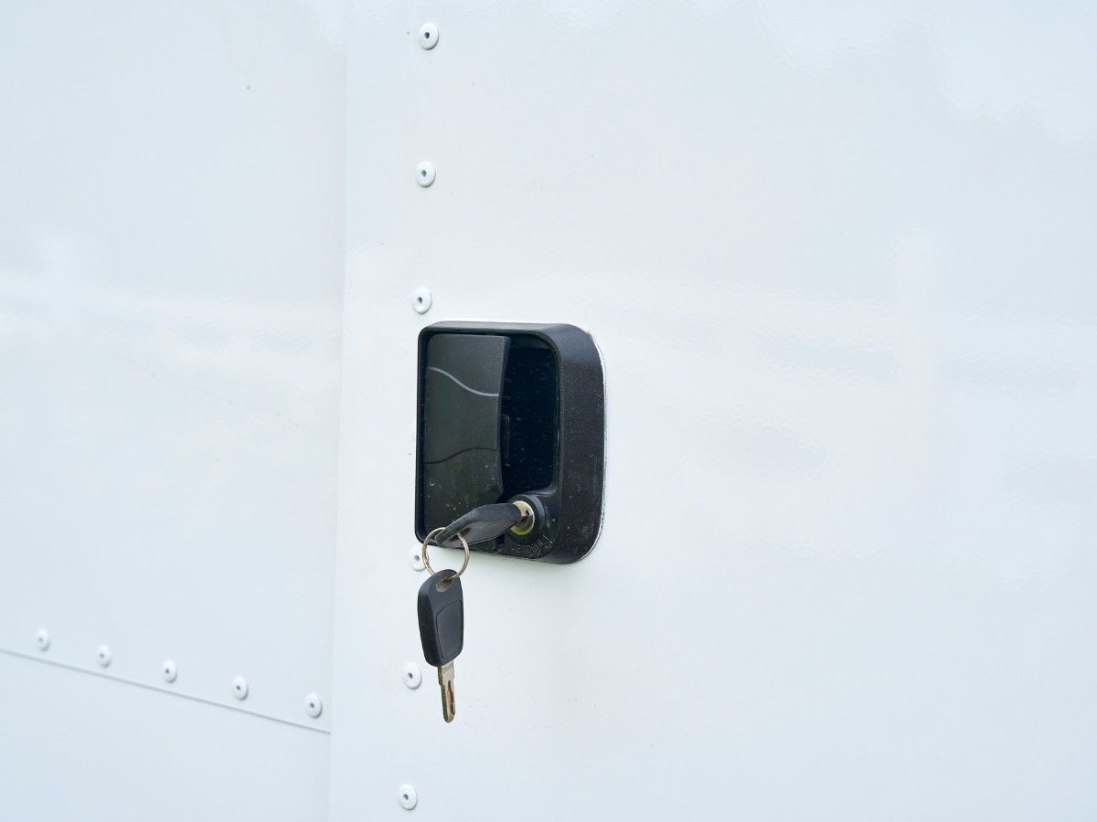 Heavy duty exterior door lock with keys on a Chris Machinery food trailer body