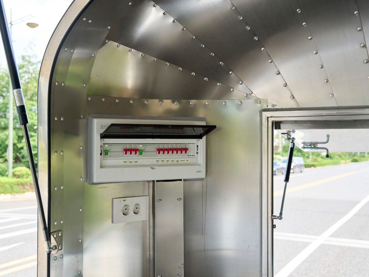 Electrical breaker box and distribution board inside a Chris Machinery Airstream food trailer