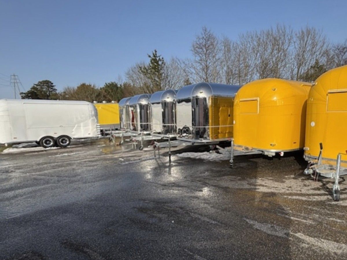 Chris Machinery bright yellow food trailer setup at customer outdoor street park