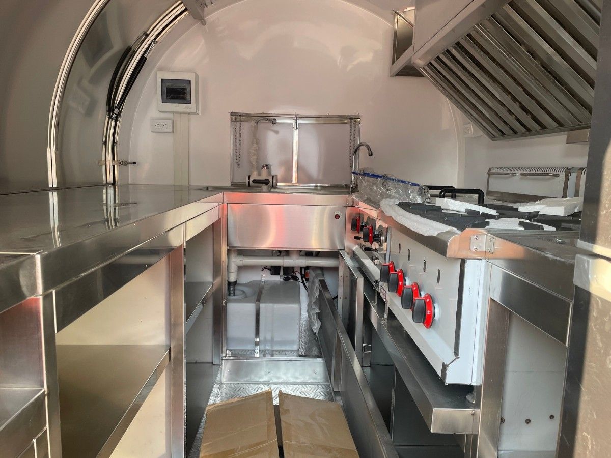 Pod interior with fryer,range hood and sink system