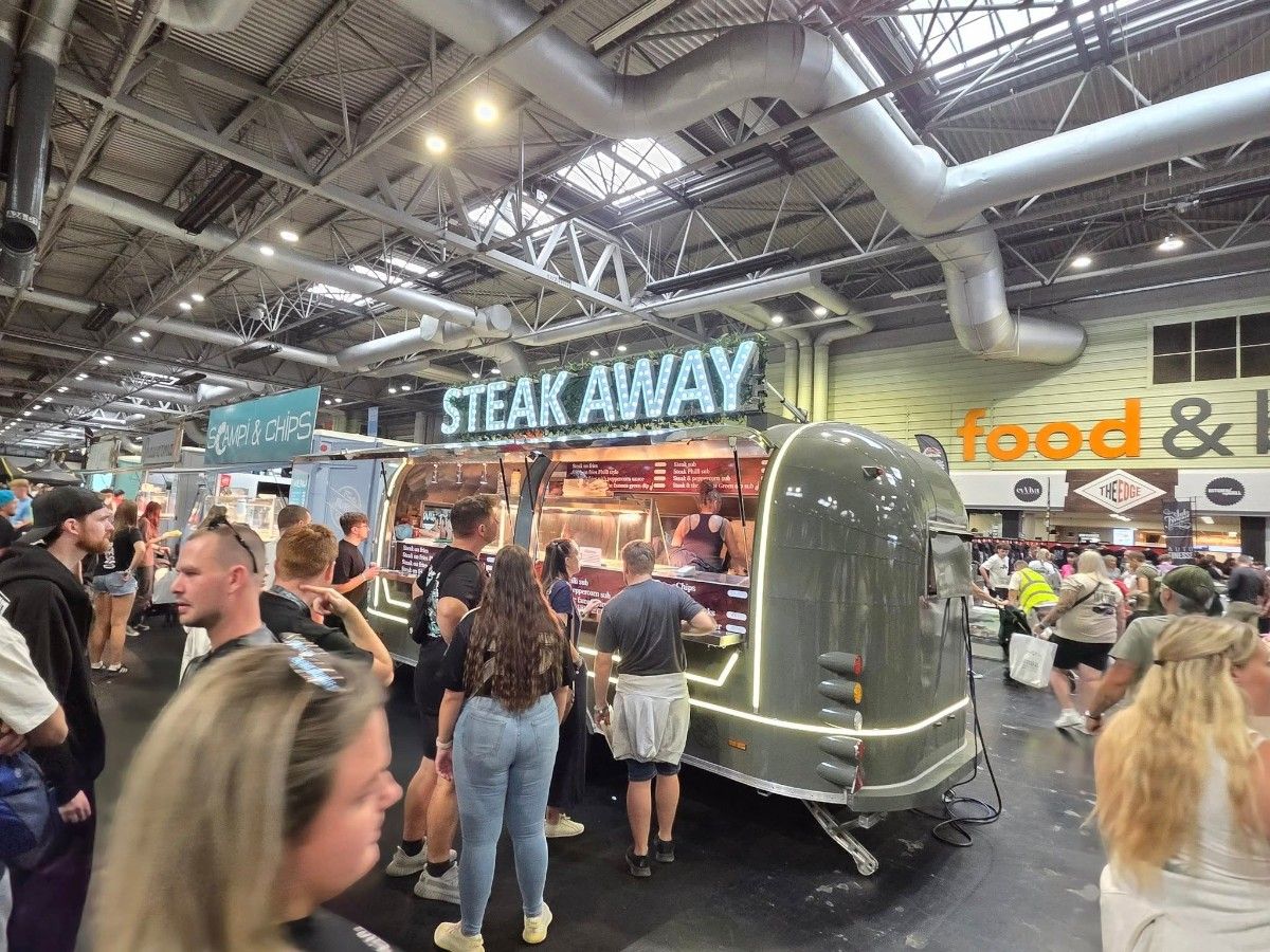 Chris Machinery food trailer operating inside busy indoor food court venue