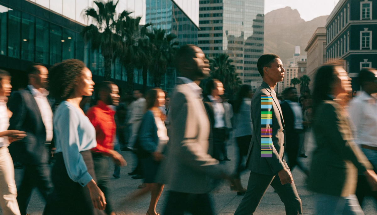 A focused professional moving with purpose through a sunlit Cape Town business district, a busy crowd blurred around them.