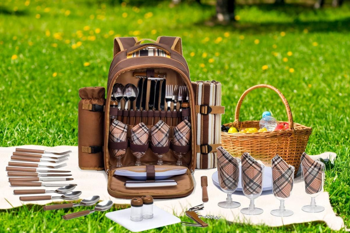 An elegant boho pop-up picnic at the park with a low wooden table, charcuterie board, and chilled champagne.