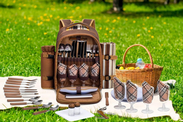 An elegant boho pop-up picnic at the park with a low wooden table, charcuterie board, and chilled champagne.