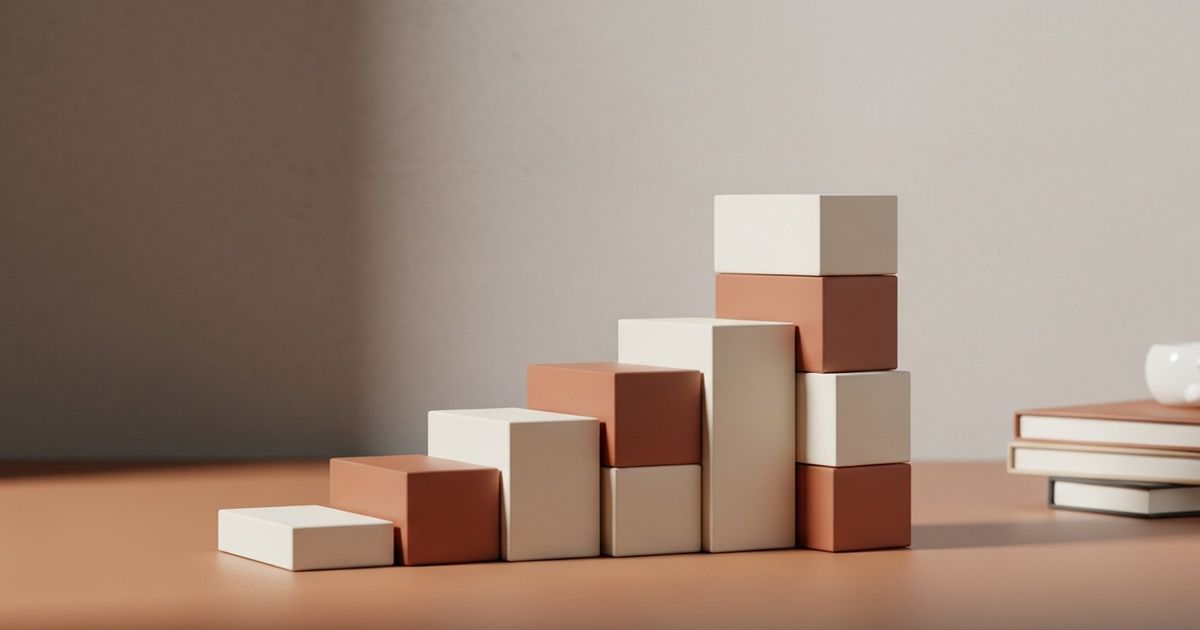 Unbranded product boxes stacked like a rising chart on a clean desk, warm lighting evoking ecommerce growth.