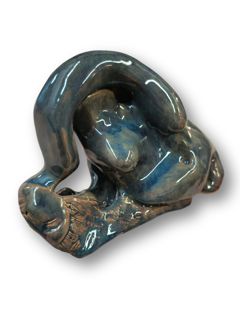 Ceramic sculpture of a figure melting