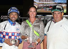 The winning connections of Relentless Rocket accept the Northlands Futurity stakes trophy Thursday night at Canterbury Park.