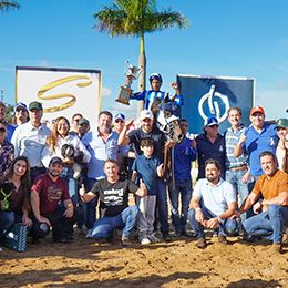 Owner Celso Alves de Alcântara, trainer Kelvin Bispo, jockey Vitor Lima, and the Winchester Cartel team celebrate after capturing the 2026 Megarace at Jockey Club de Sorocaba.