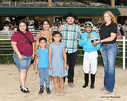 The winning connections of Zef Lucky Seis accept the $34,950 Jones Bloodstock Insurance Starter Stakes winning trophy on Friday at Retama Park.