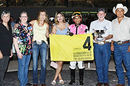 The winning connections of The Grand Legend accept the Governors' Cup Marathon stakes trophy on Saturday at Sam Houston Race Park.