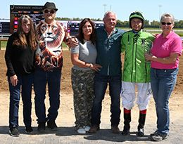 The connections of TW No Beach Secrets accept the QHRAI SSA Futurity Juvenile winning trophy at Horseshoe Indianapolis on Saturday.