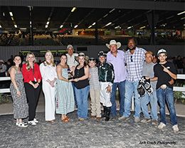 The winning connections of Celebratingtheeagle accept the $55,500 Miss Sam Houston Stakes trophy on Saturday.