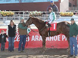 The winning connections of Jess No Secrets accept the Rocky Mountain Quarter Horse Championship Stakes trophy Saturday at Arapahoe Park.