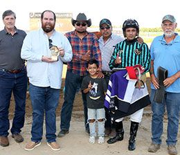 The winning connections of Full Boogie accept the Escondido Beach Overnight Stakes trophy.