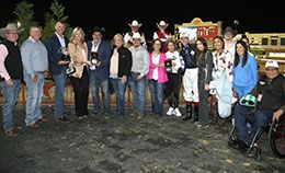 The winning connections of Asscher accept the Texas Classic Oaks sponsored by Purina Feeds stakes trophy at Lone Star Park Saturday.
