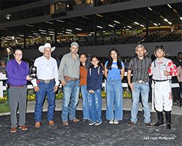 The winning connections of Kas Prietito accept the $75,000 Sam Houston Classic trophy at Sam Houston on Saturday.
