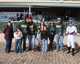 The winning connections of Maka Roon accept the $100,000 New Mexico Classic Distaff Stakes trophy at Zia Park on Sunday.