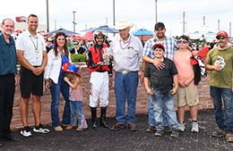 The winning connections of Ts Cyber Flash accept the Hawkeye Futurity stakes trophy at Prairie Meadows Friday evening.