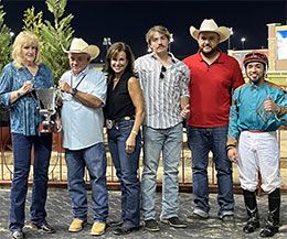 The winning connections of Hes A Jet One accepting the B.F. Phillips, Jr. Stakes trophy at Lone Star Park.
