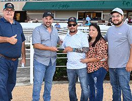 The winning connections of Jackson Davis accept the PHBA Paint Horse Juvenile Stakes trophy at Retama Park.