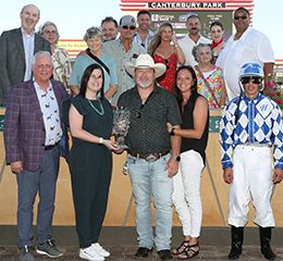 The winning connections of Eos Keep Dreamin accept the $48,000 Minnesota Quarter Horse Futurity trophy at Canterbury Park on Saturday.