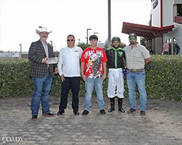 The winning connections of Indefensible accept the $100,000 Ruidoso Juvenile Stakes trophy at the Downs of Albuquerque on Sunday.