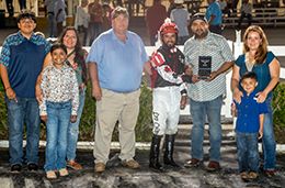 The winning connections of Tf Jess Doing Curls accept the $20,000 Delta Dash Stakes trophy at Delta Downs on Saturday.