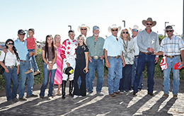 The winning connections of Kj Bad Moon Rising accept the Jess Burner Stakes trophy on Saturday.