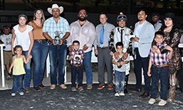The winning connections of Fire Cowboy accept the $280,450 Sam Houston Derby [G3] trophy at Sam Houston on Saturday.