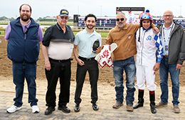 The winning connections of Norchor Secret accept the $99,200 Harley Greene Derby trophy at Horseshoe Indianapolis on Saturday.