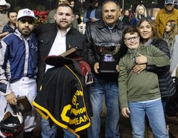 The winning connections of FDD Dreams accept the $700,000 Champion of Champions-G1 trophy at Los Alamitos on Saturday.