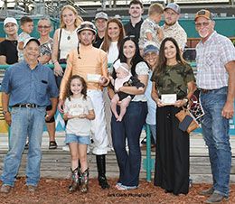 The winning connections of Flyindwntheturnpike accept the Speedhorse Paint & Appaloosa Juvenile stakes trophy at Fair Meadows.