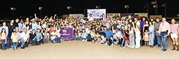 The winning connections of Joose Boxx accept the TQHA Sale Futurity [RG1] trophy on the track at Retama Park because the group was so large.