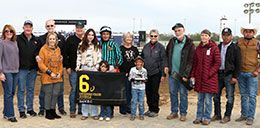 The winning connections of Sauce C accept the Governors Juvenile Stakes trophy at Horseshoe Indianapolis.