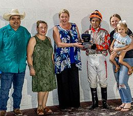 The winning connections of Famous Flyin Cowgirl accept the French Quarter Stakes trophy at Delta Downs on Thursday.